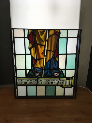 Repair to vandalised stained glass panel after