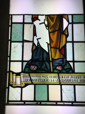 Repair to vandalised stained glass panel before